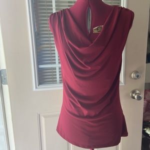 Ricki’s women red cowl neck with v back silver beads detail top. Size XS. Used.